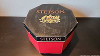 Octagonal red and black Stetson hat box