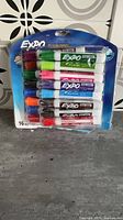 Front view of sealed 16-marker Expo pack showing assorted colours