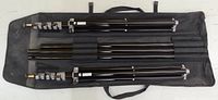 All components laid in carry case: two collapsible tripods, telescoping bar sections, clamps