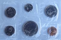 Obverse of six sealed uncirculated coins in vinyl pouch