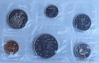 Reverse side of six 1983 Canadian coins in sealed pouch