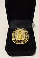 Ring in presentation box showing face with Stanley Cup and rhinestones