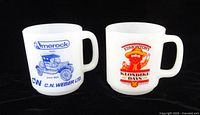 Front view of both advertising mugs showing printed graphics