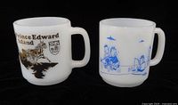 Front view of both white milk glass mugs showing PEI and Curling graphics