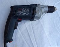 Left side view of Bosch 1032 drill showing trigger, label and cord entry