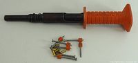 Full view of Remington tool with nails and loads