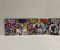 Front view of five bagged Alpha Flight comic books issues 45-48 and 52