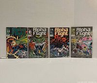 Front covers of Alpha Flight issues 58-61 bagged