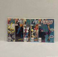 Front view of all five bagged comics standing side by side