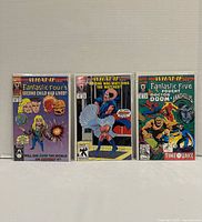 Front covers of three bagged Marvel What If... Volume 2 comic books issues 30, 34, 35