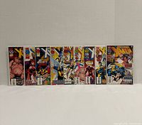 Front view of all nine bagged comic issues 1-9