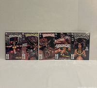 Front view of five bagged and boarded Hawkgirl comic books issues 50-54