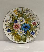 Front view of hand-painted floral ceramic plate