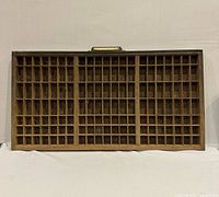 Full view of wooden letterpress type case with compartments