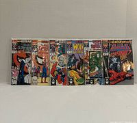 All six bagged comics displayed side-by-side