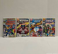 Front view of four bagged and boarded What If...? Vol 2 comic books, issues 36-39