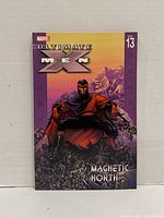 Front cover showing title, volume number, Magneto artwork
