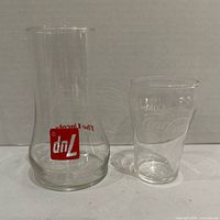 7-Up carafe and Coca-Cola glass side by side