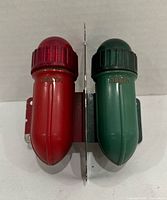 Front view showing red and green Delta boat lights with central mounting bracket