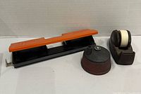 All three items: tape dispenser, pencil sharpener, hole punch