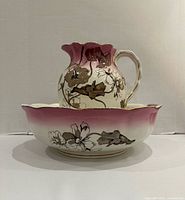 Wash basin and matching pitcher set shown together