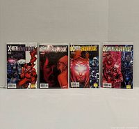 Front view of four bagged and boarded X-Men: Search for Cyclops comic books issues 1-4 standing upright