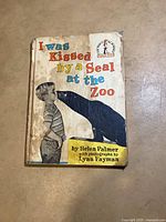 Front cover of 'I Was Kissed by a Seal at the Zoo' showing wear
