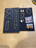 Overview of all jewelry pieces on two foam boards