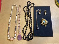 All six jewelry pieces laid out