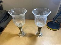 Pair of crackled glass hurricane candle holders full view