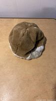 Brown faux fur hat top view