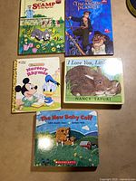 All five children's books laid out showing covers