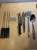 Group shot of all utensils in lot