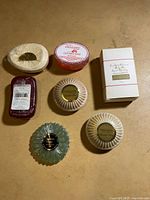 Group shot of all seven soaps on surface