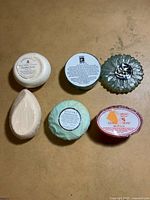Overview of six assorted soaps laid out