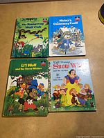All four Disney books front covers visible