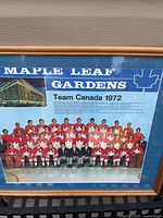 Framed Team Canada 1972 photo full view showing blue mat and wood frame