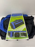 Full view of folded 36 in rolling duffel with packaging card