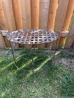 Full view of metal table showing lattice top and structure