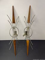 Full view of both teak and metal wall candleholders