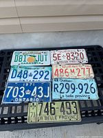 All seven plates laid out on black crate