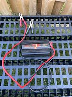 Full view of Eliminator 700W inverter with attached cables