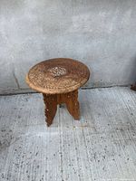 Full view of carved hardwood side table