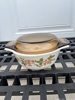 Side view showing floral pattern, base and lid together