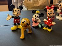 Group shot of Mickey, Minnie, Pluto ceramic figures