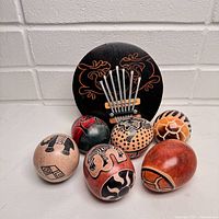 Overview of kalimba and six soapstone eggs