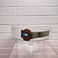Side view showing etched band, slanted rim and wood-turquoise accent