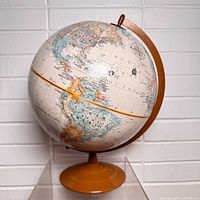 Full view of globe showing Americas and Pacific on orange base