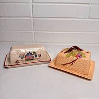 Both butter dishes side by side showing overall forms and patterns