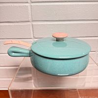 casserole dish with lid on, side handle visible